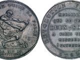 a close up of a coin with a man on it