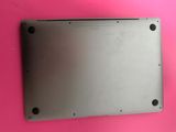 a close up of a metal plate on a pink surface