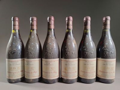 six bottles of wine are lined up in a row on a table