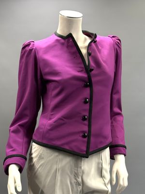 the mannequin is wearing a purple jacket and beige pants