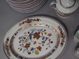 many plates and cups that are sitting on a table