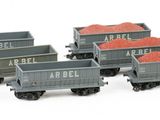 a lot of toy trains that are on a white surface