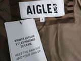 an image of a jacket with a tag attached to it