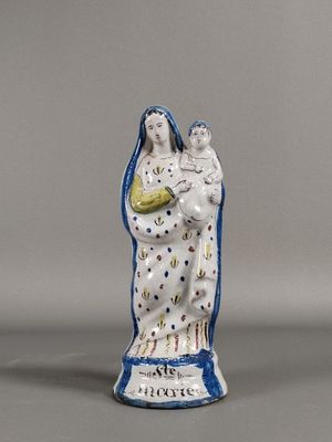 an image of a statue of a woman holding a child