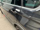 a car that has a sticker on the side of it ' s door