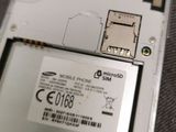 the back of a cell phone with a sim card attached to it