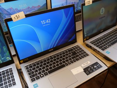 several laptops are on display in a store with price tags on them