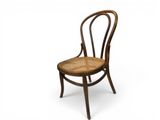 a wooden chair with a wicker seat on a white background