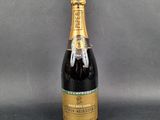 a close up of a bottle of champagne on a table