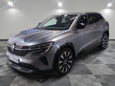 a silver suv parked on a checkered floor in a garage