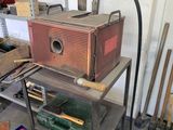a metal shelf with tools on it in a garage