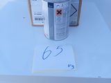 a can of paint sitting on a table next to a cardboard box