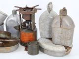 a lot of old metal items that are sitting on a table