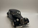 a toy car that is sitting on a white surface