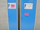 two blue lockers next to each other on a sidewalk