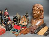 a statue of a man surrounded by various items