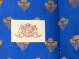 a blue book with gold designs and a coat of arms on it