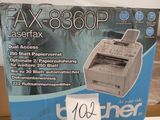 the box of the printer is sitting on the table