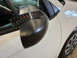 a close up of a car ' s rear view mirror with a tape attached to it