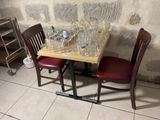 a small table with wine glasses and wine glasses on it