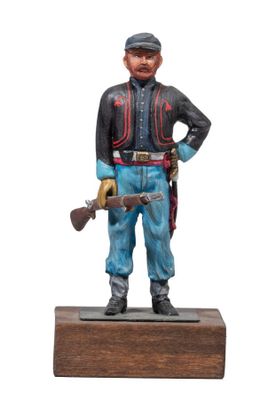 figurine of a soldier with a gun on a wooden base