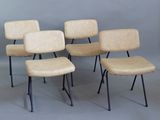four chairs with black legs and a beige seat on a gray background