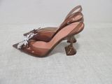 brown high heeled shoes with bows and bows on the toes