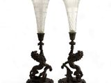 pair of antique glass vases on stand on white background