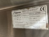 a sign on the side of a stainless steel refrigerator