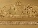 a gold plate with a picture of a man and a woman on it
