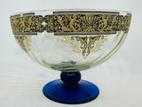 a glass bowl with a gold and blue design on it