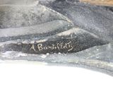a close up of a piece of art with writing on it