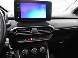 the dashboard of a car with a tablet on the dashboard