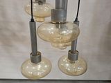 three light bulbs that are hanging from the ceiling