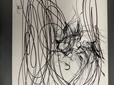 a black and white drawing of a woman ' s face on a piece of paper