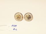 two pairs of gold and diamond earrings on a white surface