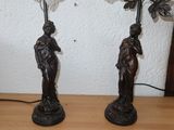 two lamps that are sitting on a wooden table