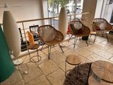 a room with a lot of chairs and tables in it