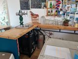 a counter with a bunch of wine glasses on it
