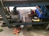an image of a workbench with a lot of tools on it