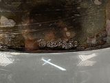 a close up of a metal bowl on a table