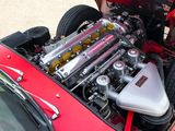 a red car with an engine in the back of it