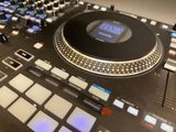 a close up of a dj controller on a table