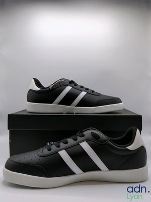men ' s adidas sneakers in black and white with a white stripe on the side