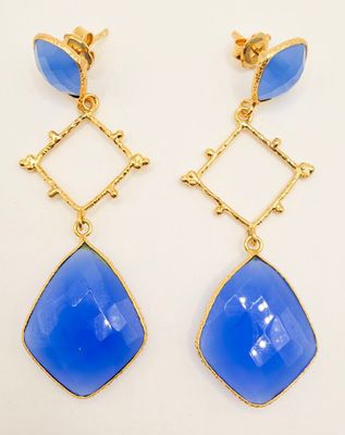 a pair of blue glass earrings with gold accents