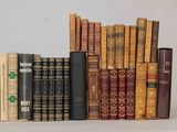 a lot of books that are sitting on a shelf