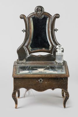 a small table with a mirror on top of it