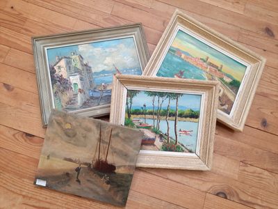 three framed paintings of boats on a wooden floor next to each other