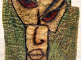 an image of a painting of a face on a piece of paper