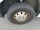 a close up of a flat tire on a truck